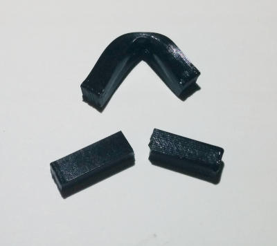 A non-annealed bar (bent) and an annealed bar (broken).