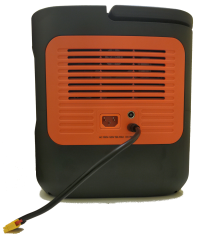 The right side of a Jackery Explorer 2000 v2. A cable that ends in Anderson Powerpole connectors is plugged into the bottom solar panel input.